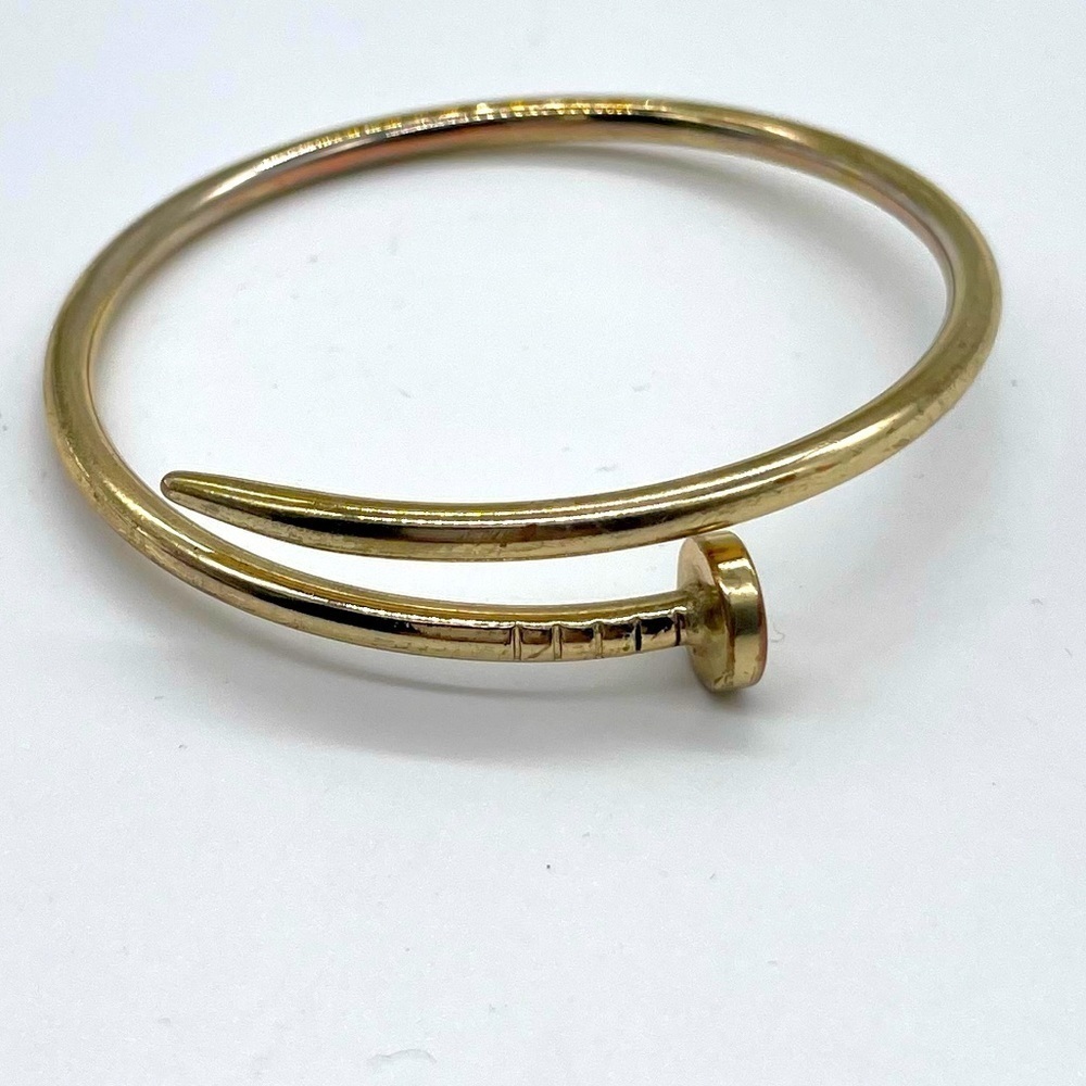 Nail Bangle in Gold Tone